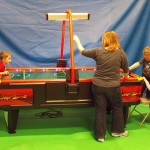 Family Plays Air Hockey 2000